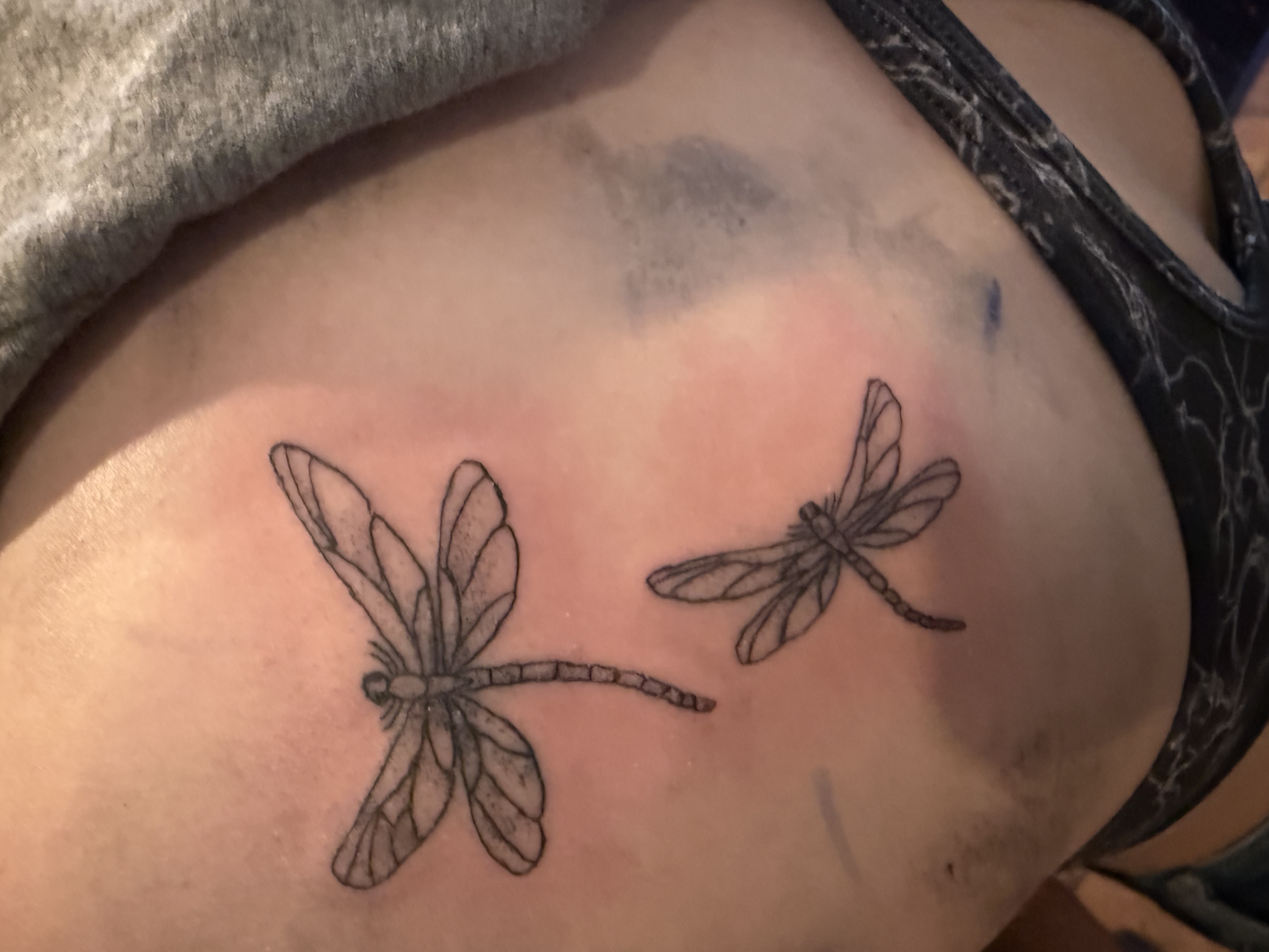 Fine line pair of dragonflies tattoo